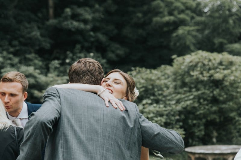 bride hugging guest