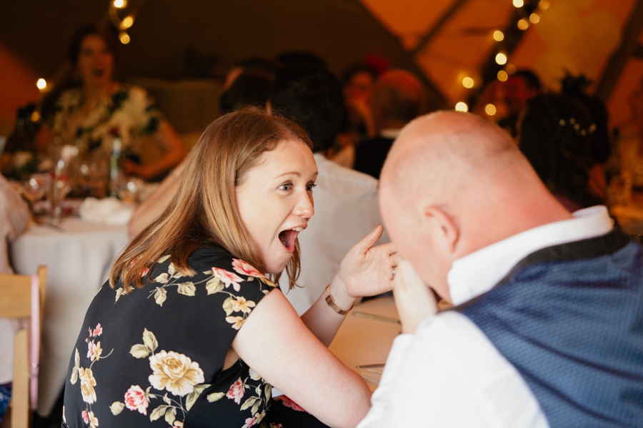 wedding guests laughing