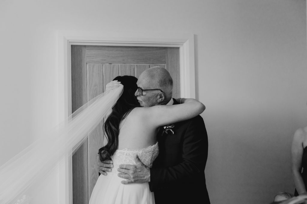 bride hugging dad