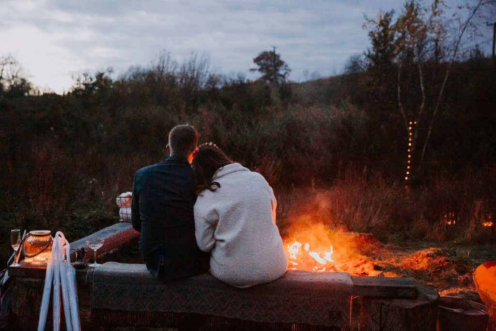 wedding couple by fire