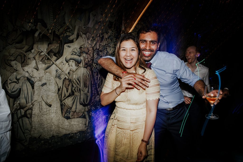 laughing wedding guests