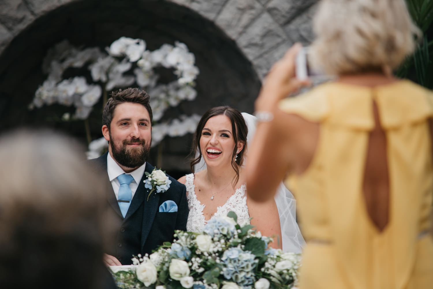 laughing wedding couple