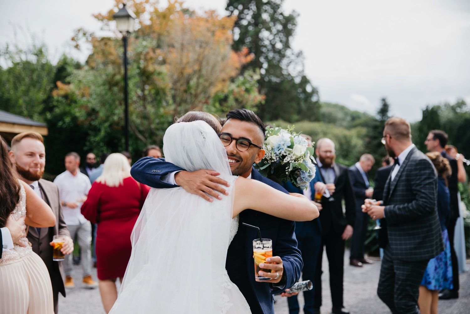 wedding guests hugging