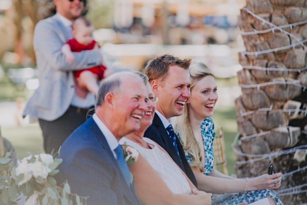 wedding guests laughing