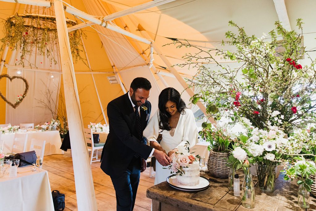couple cutting cake
