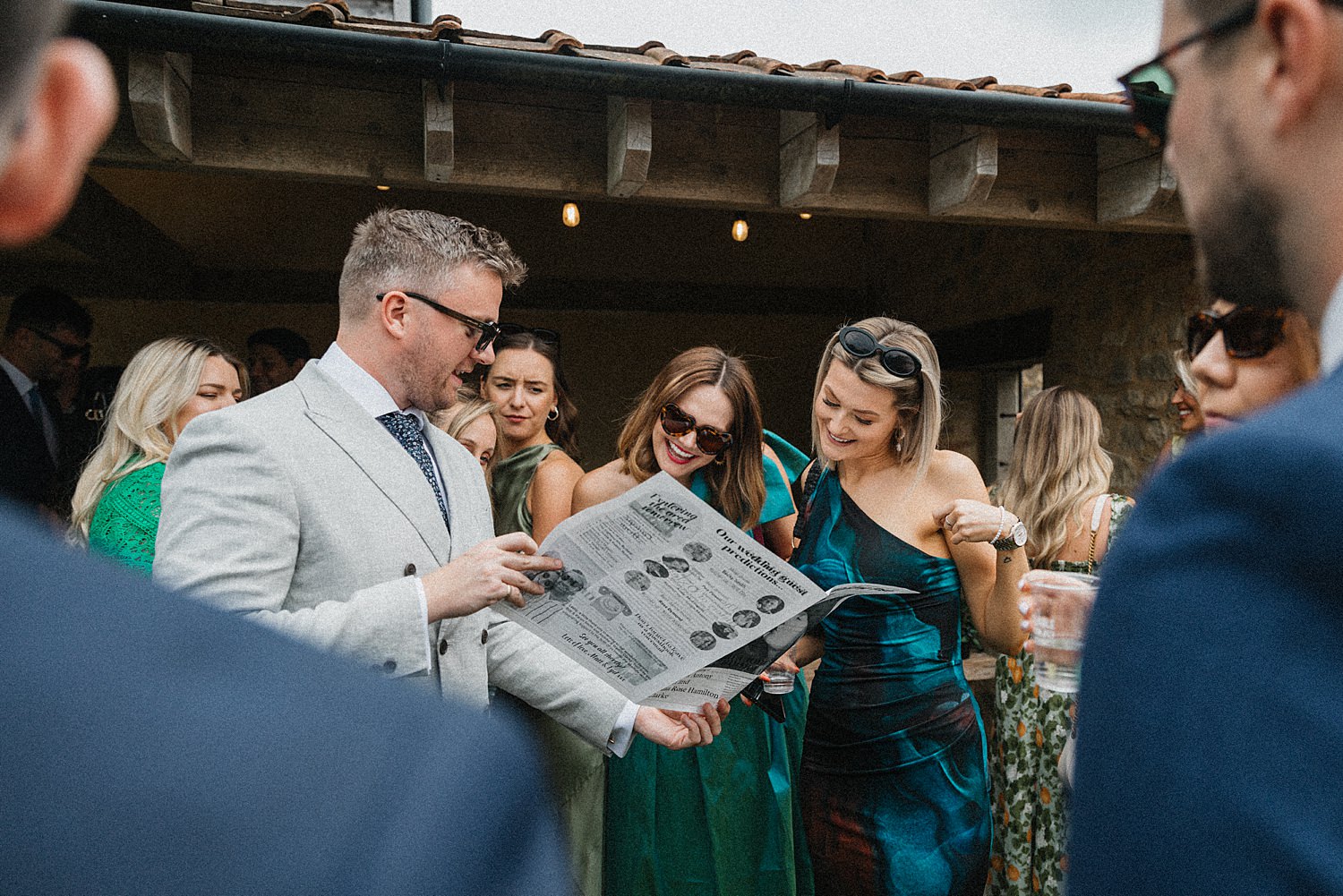 wedding guests reading newspaper