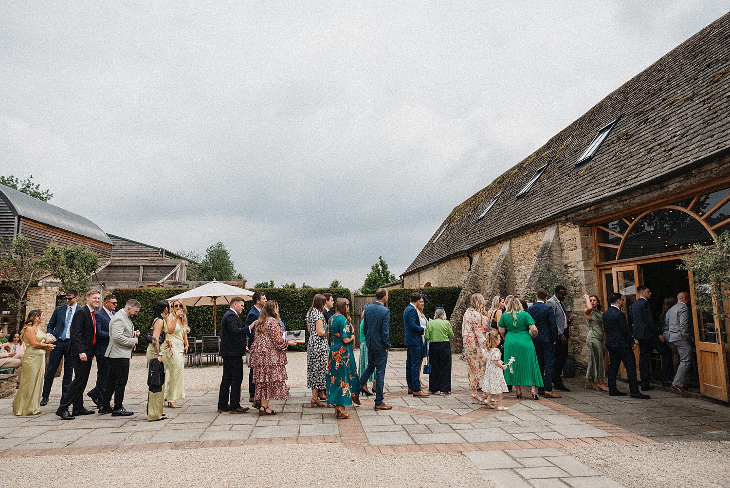 guests entering wedding barn