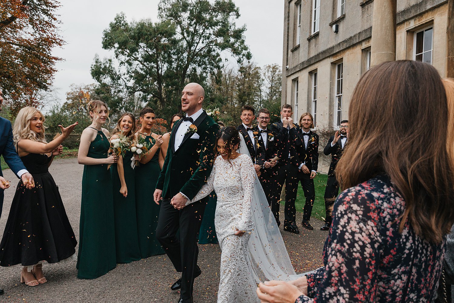 WEDDING COUPLE COVERED IN CONFETTI