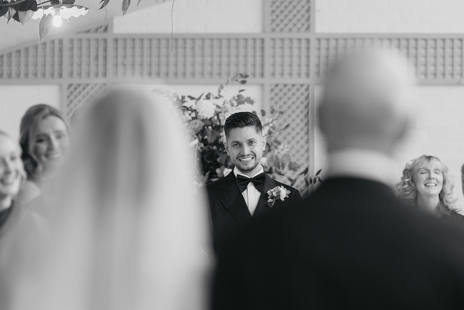 groom looking at bride