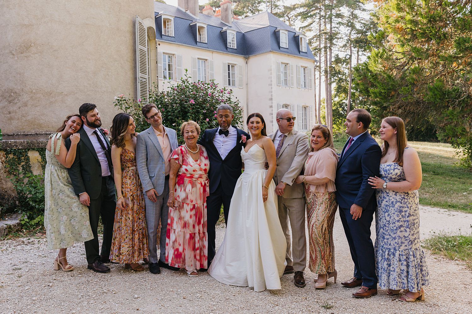 laughing wedding guests at Château de Thauvenay